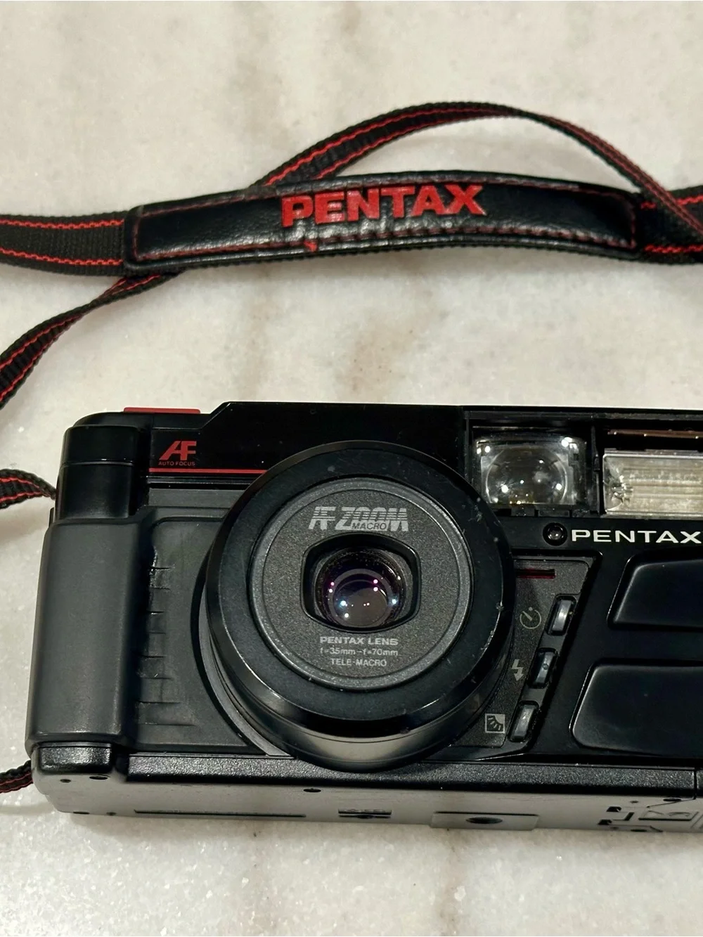 Pentax Black Point-and-Shoot Film Camera with Red-Trim Strap